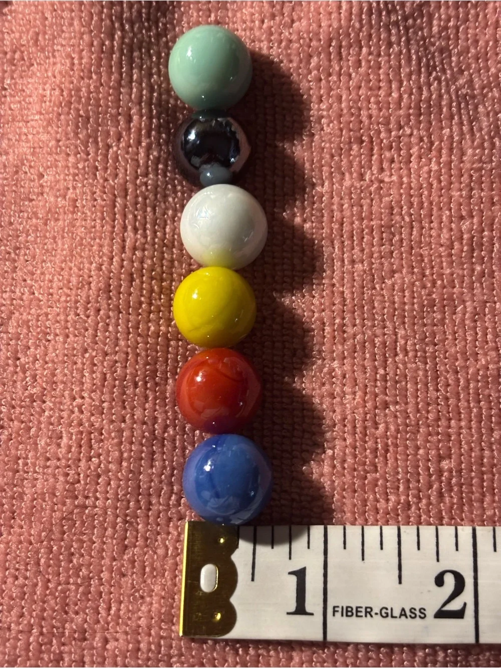 Set of 57 solid-color replacement glass marbles, 6 colors,